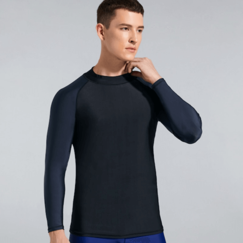 Man wearing sun protection men's elastic compression shirt for swimming and sports, showcasing breathable, quick-dry material.